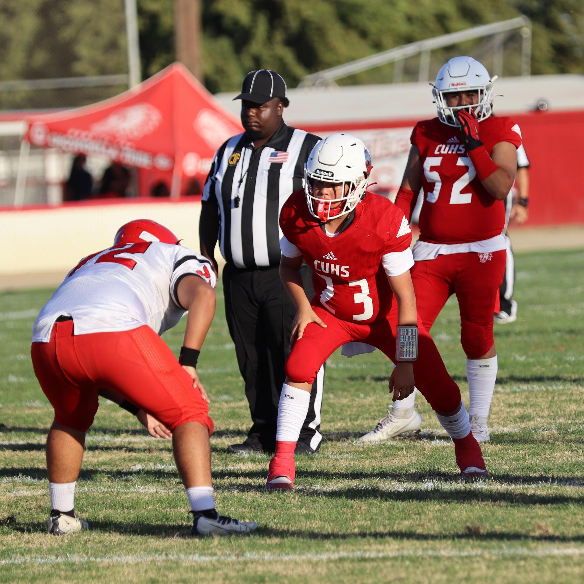 junior varsity football players in action against Fowler
