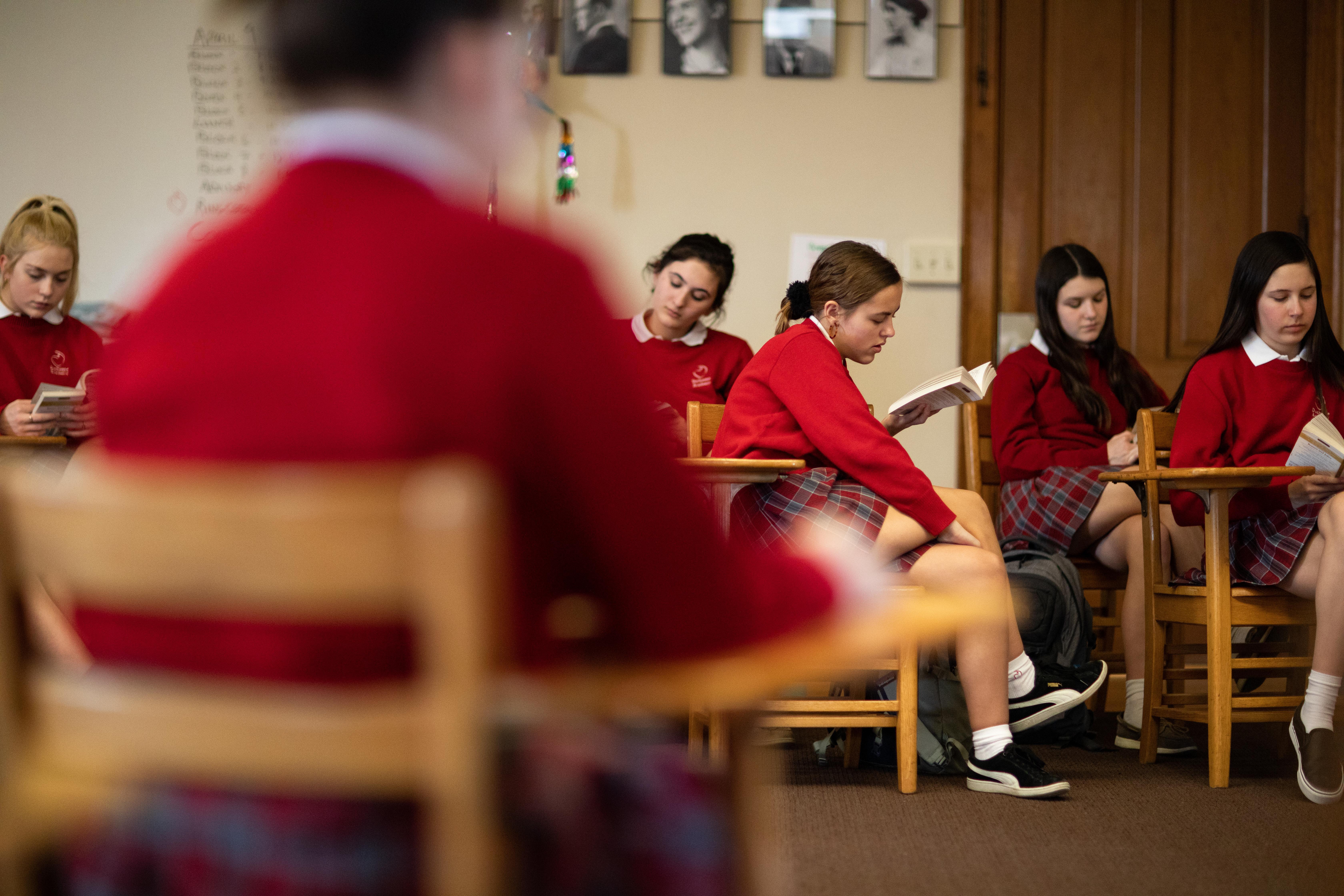students reading in class