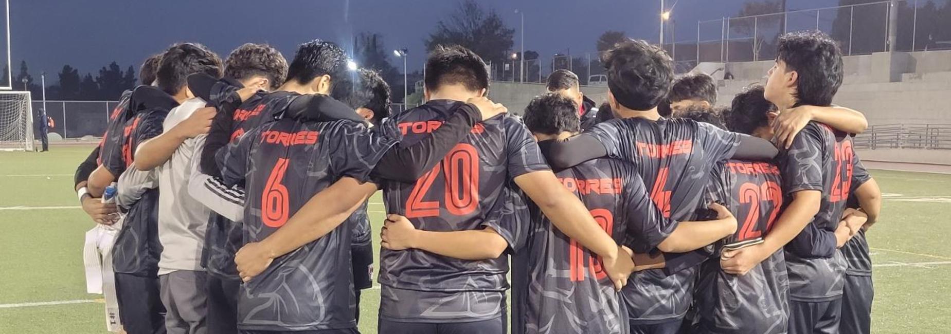 futbol team in a huddle