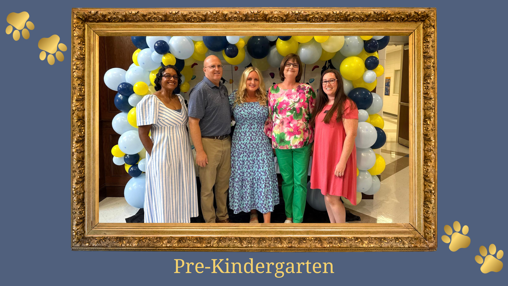 Five educators smiling in front of a balloon arch, labeled 'Pre-Kindergarten'.