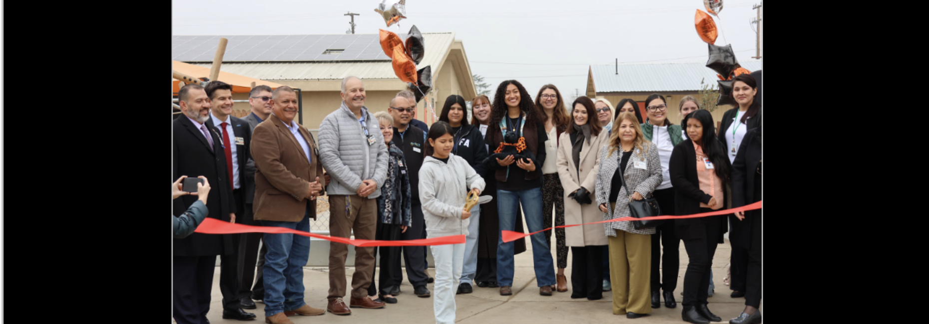 Green schoolyard ribbon cutting