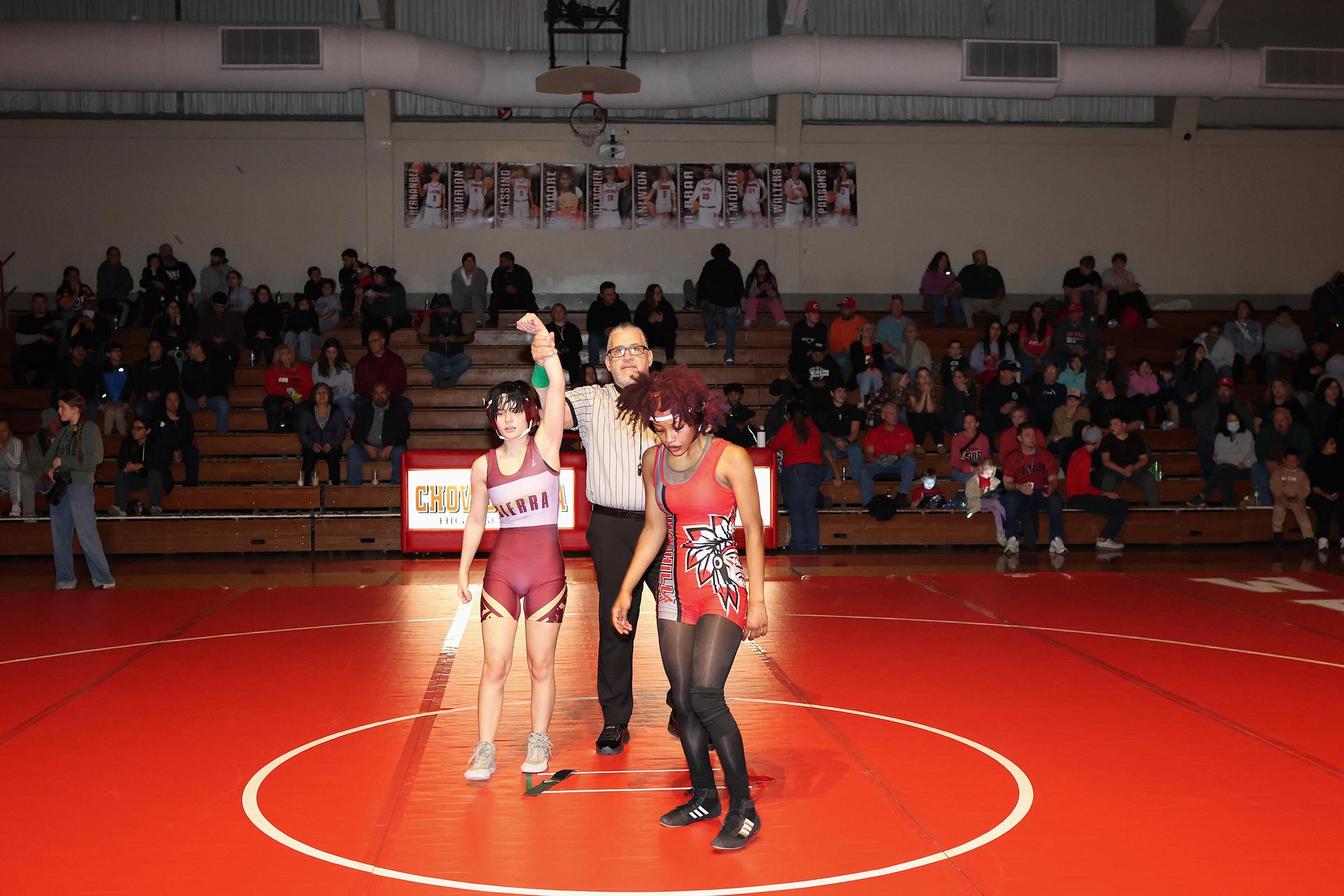 Wrestling winners with hands up 7