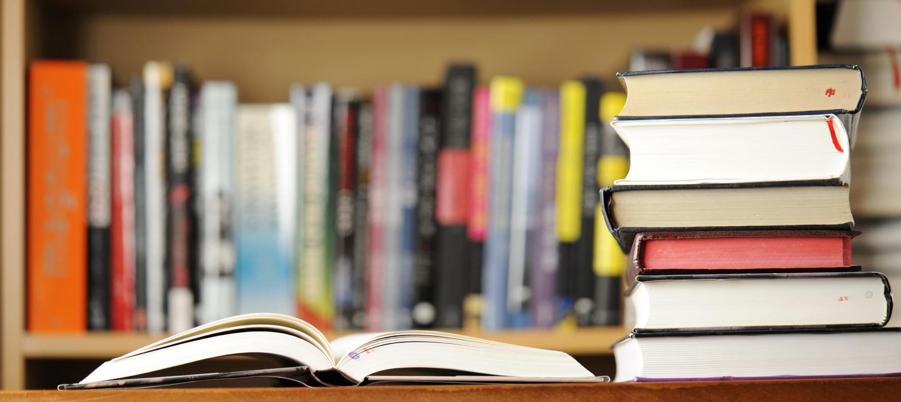 Stack of books on library table