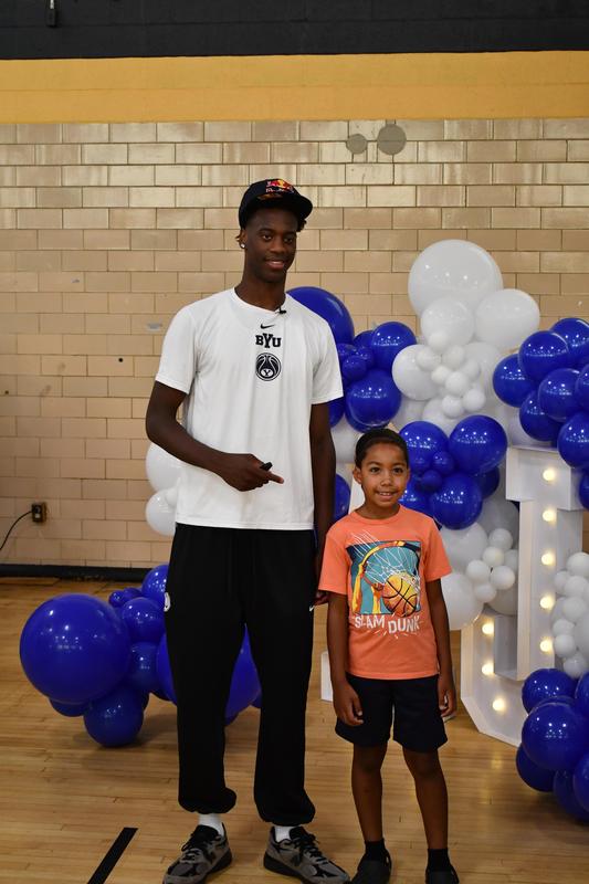 Dybantsa poses for a photo with a student