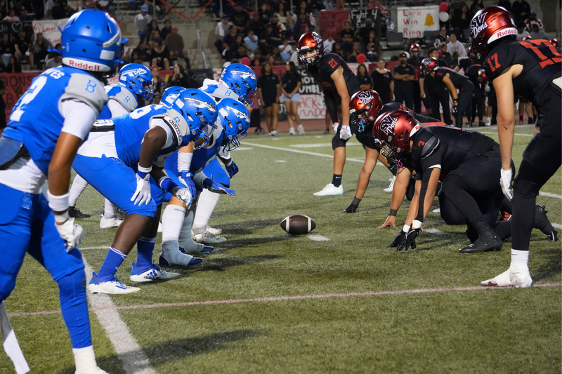 student athletes face off at football game