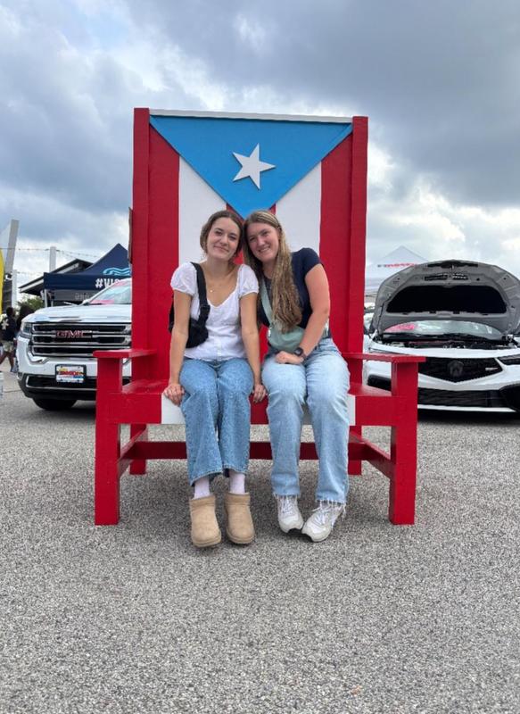 Two students sitting for a photo