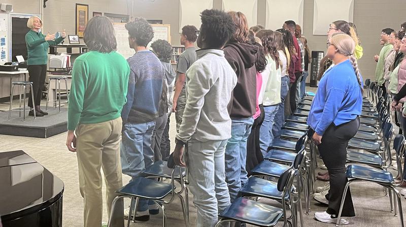 Mealand Ragland-Hudgins/Rutherford County Schools Siegel High choral director Brenda Gregory warms up the Chamber Choir during a taping for the 57th Annual Country Music Association Awards. The segment featured singer-songwriter Chris Young, who was a student of Gregory's at Oakland High.