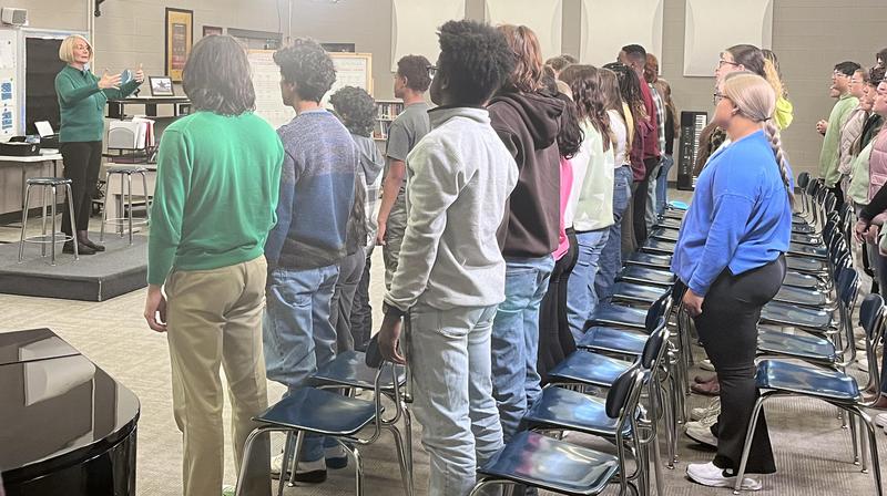 Mealand Ragland-Hudgins/Rutherford County Schools Siegel High choral director Brenda Gregory warms up the Chamber Choir during a taping for the 57th Annual Country Music Association Awards. The segment featured singer-songwriter Chris Young, who was a student of Gregory\'s at Oakland High.