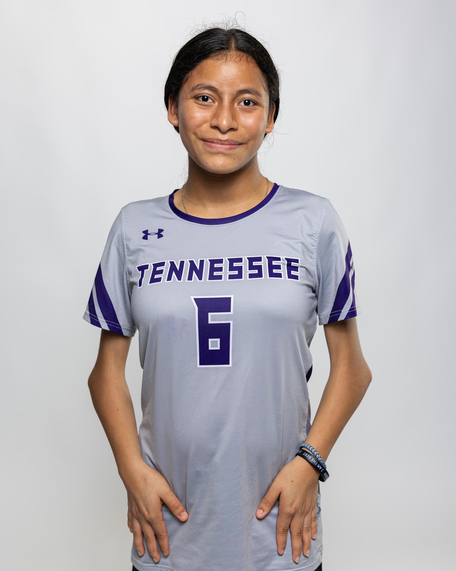 number 6 female volleyball player posing