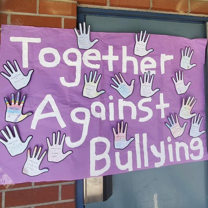 Student artwork of hands with messages