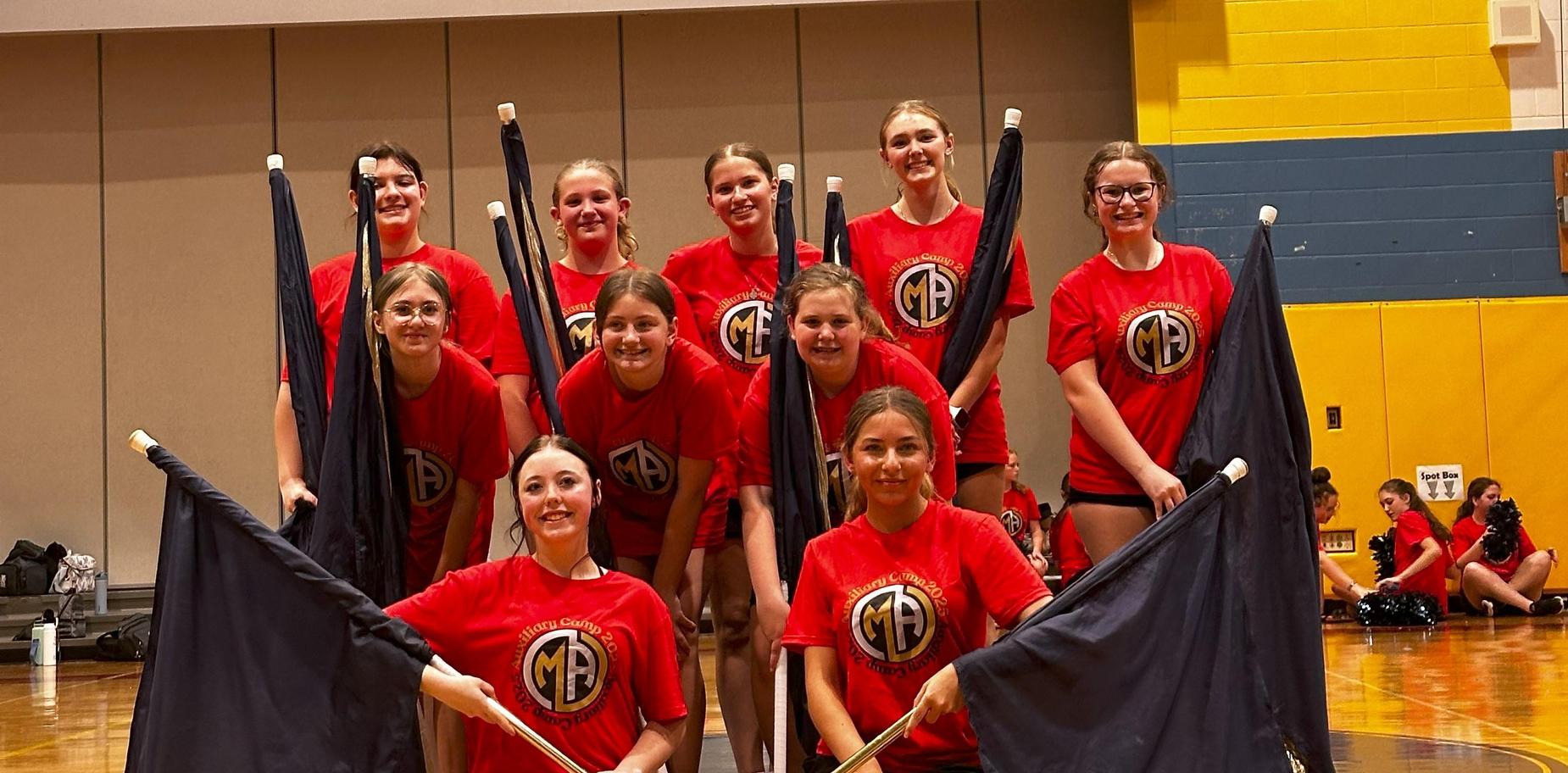 drill team holding flags and posing