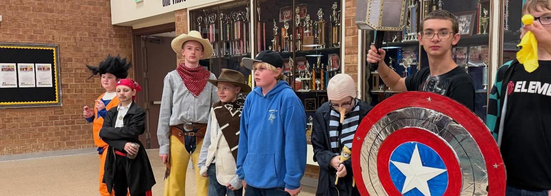 A lineup of kids in various costumes, including a cowboy, pirate, and superhero.