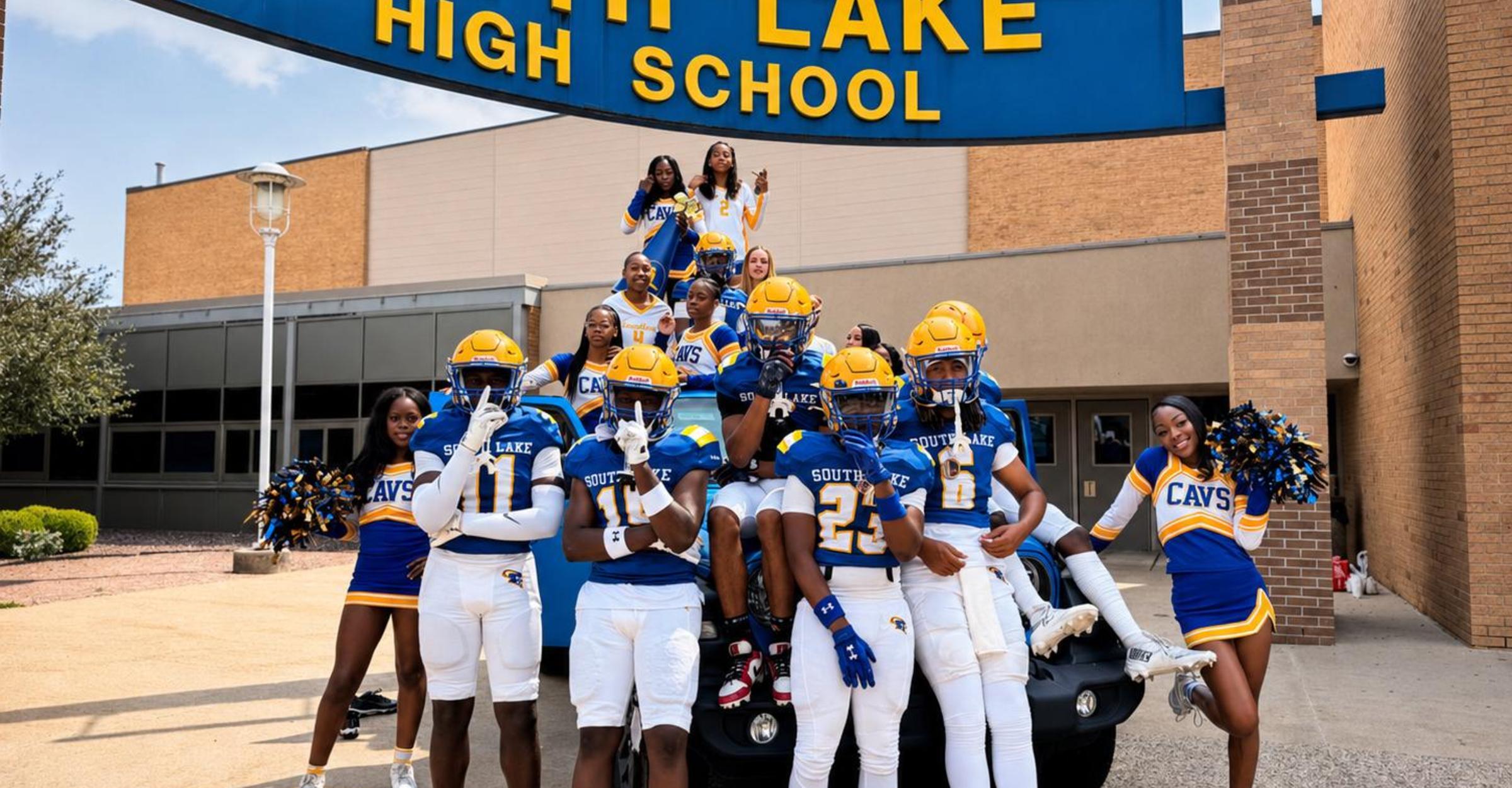 Football team and cheerleaders in front of the school