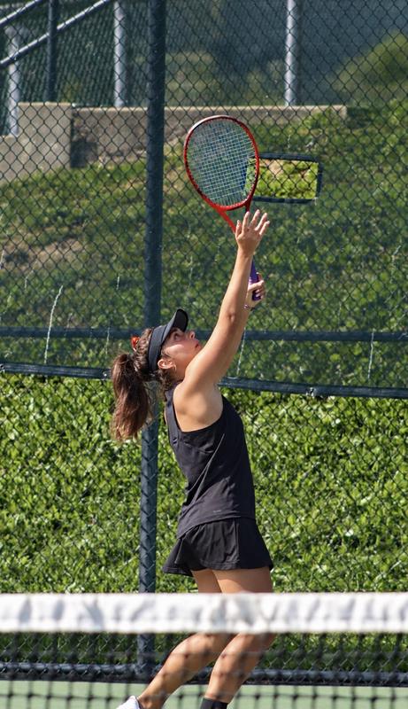 Cami Fisher serves the ball in her match vs. Mt. Lebanon on Sept. 14. The team won 4-1 over the Blue Devils.