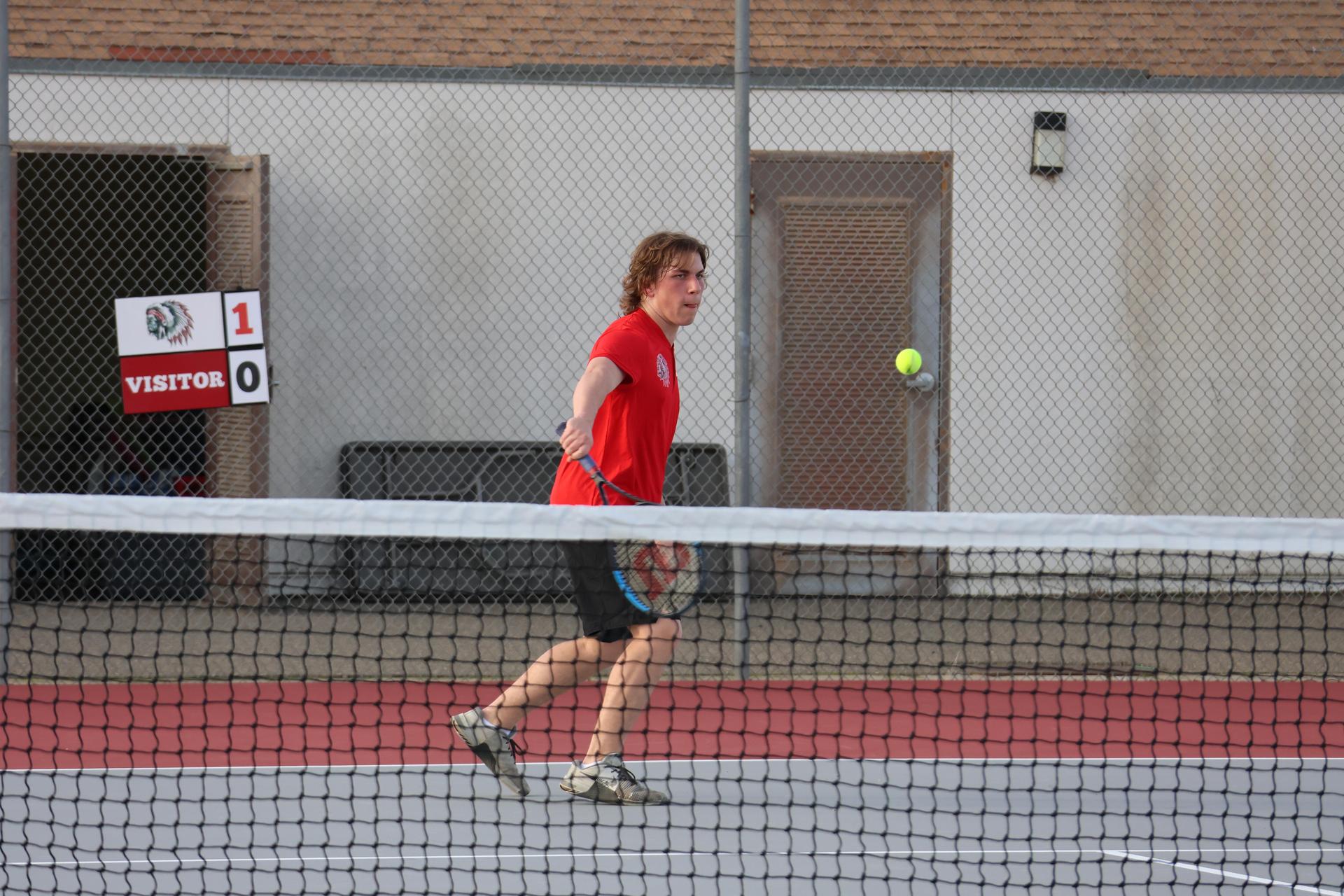 CUHS Boys playing tennis against coalinga