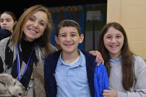 A grandmother poses with her grandkids