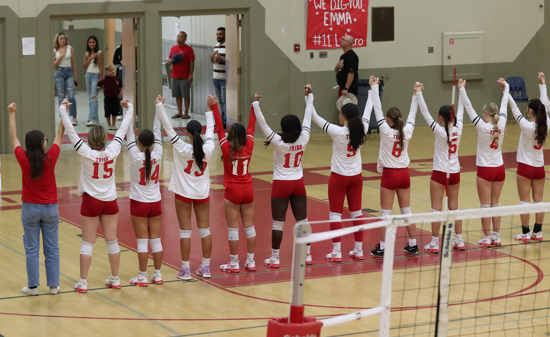 varsity volleyball players in action against Minarets