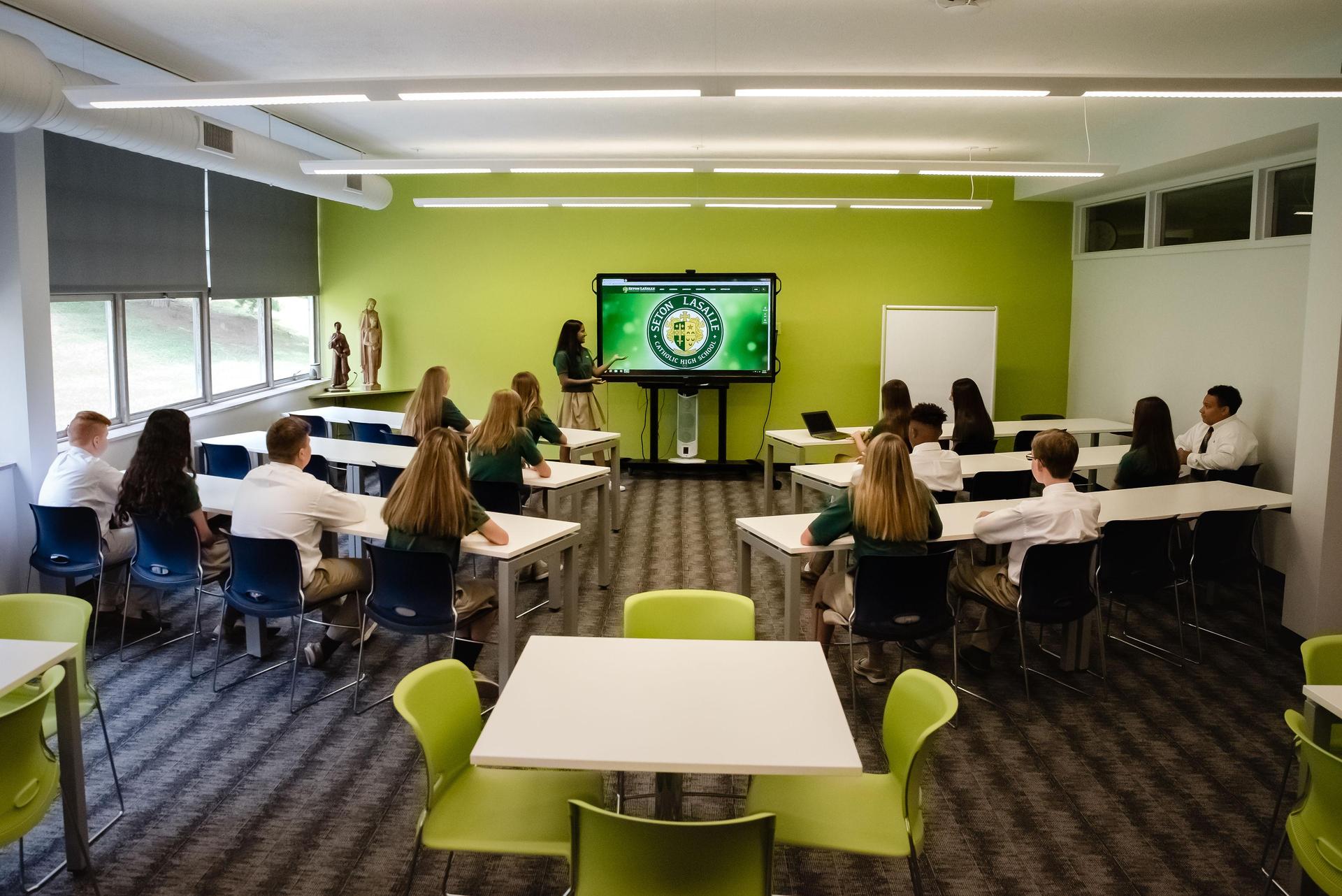 Student presents in Media Center - classroom area