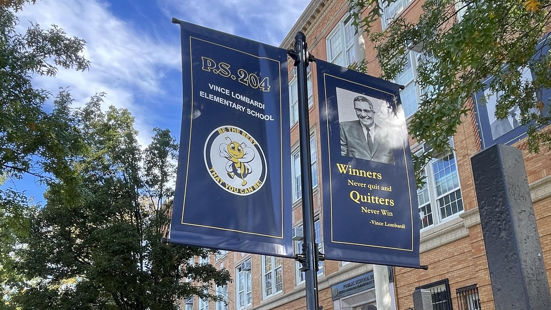 PS 204 outdoor view with banners.