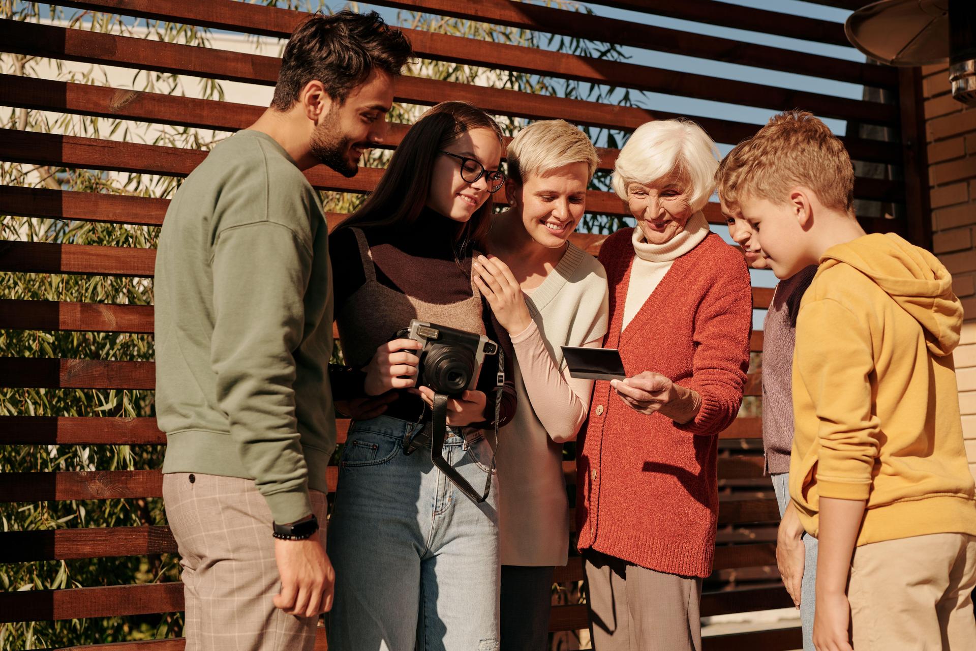 People looking at a photograph