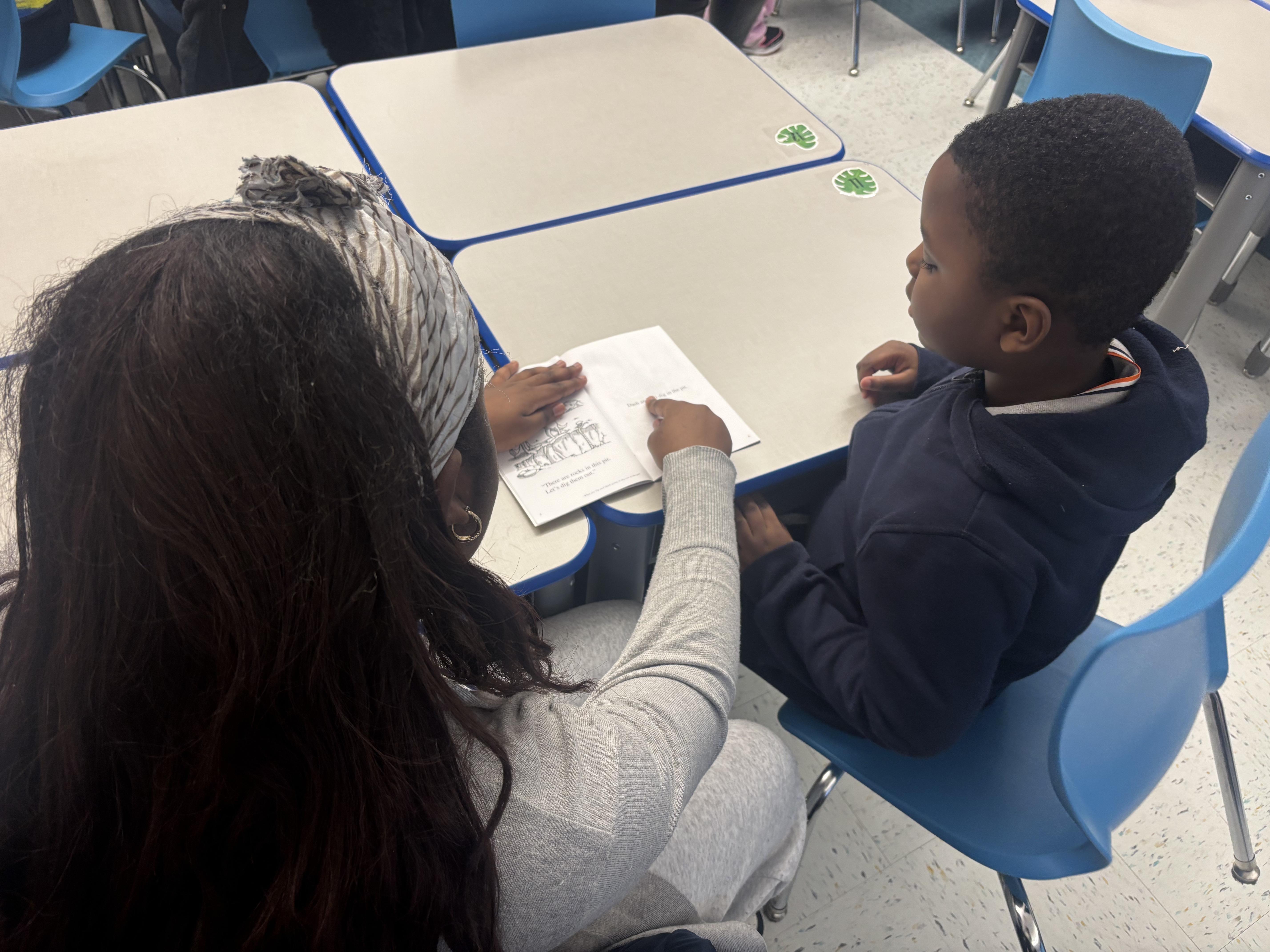 student reading with the tutor