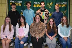 The award winners are gathered in front of a Penn-Trafford backdrop