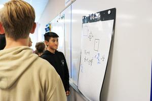 students discuss math problem