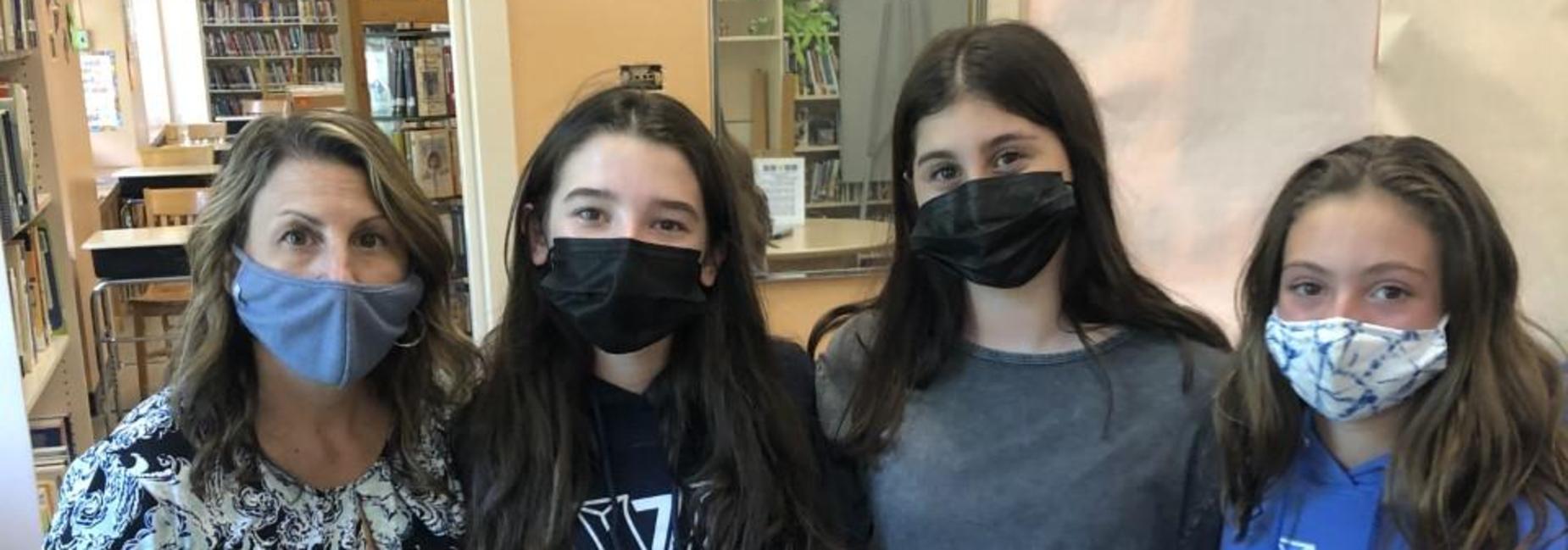 Miss Testa with 3 female students