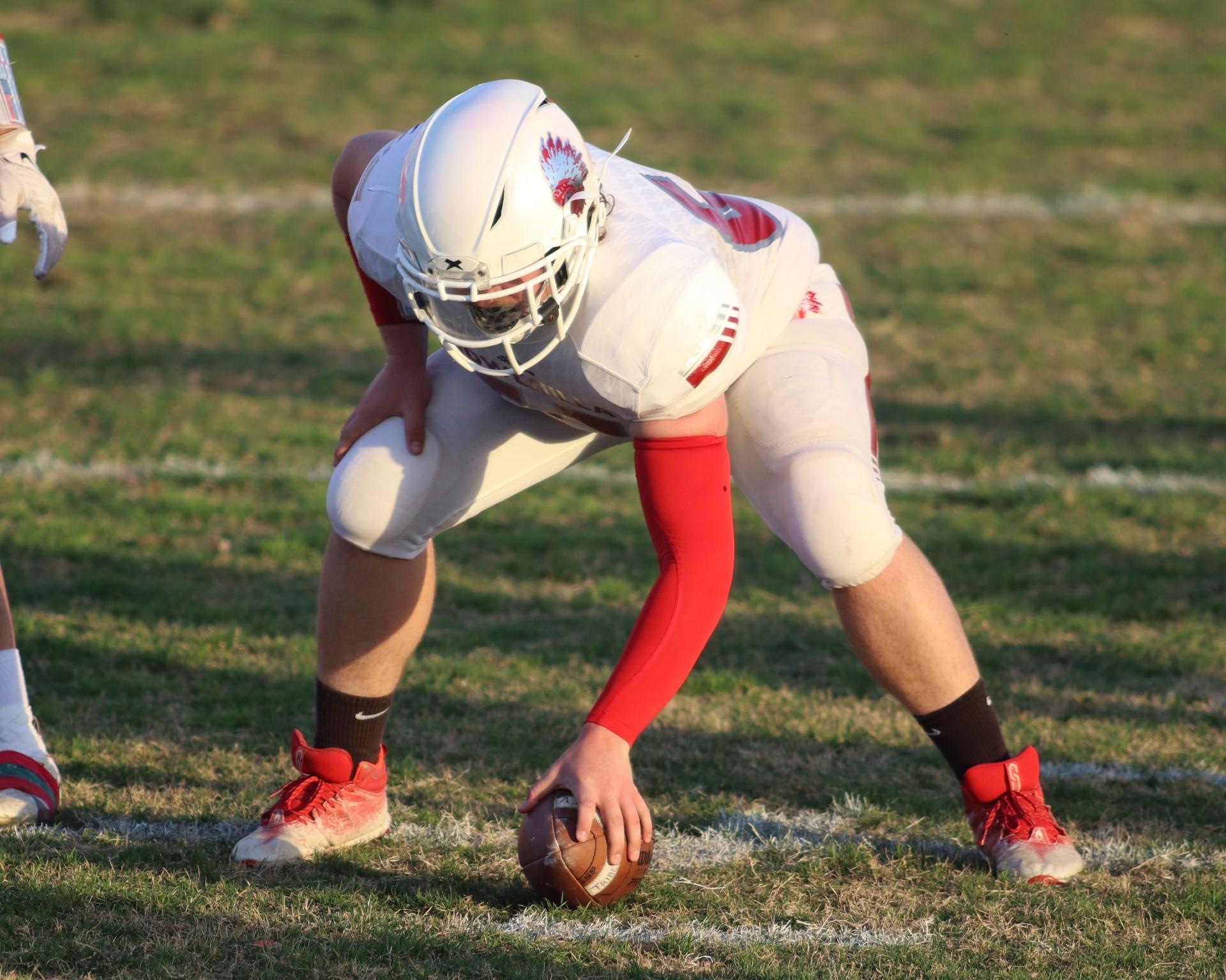 Junior Varsity football players in action against Caruthers