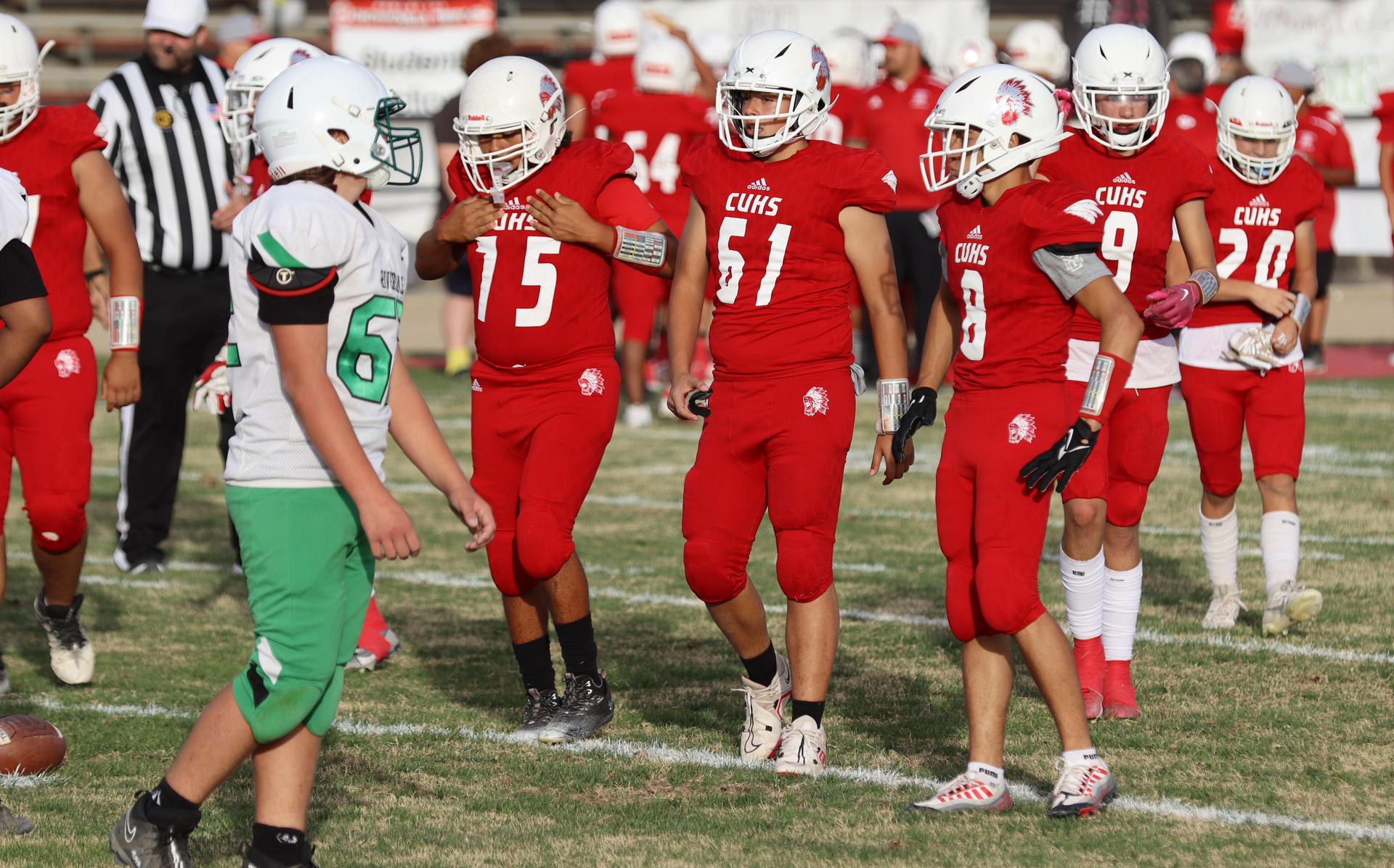  junior varsity football players in action against riverdale