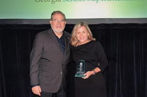 Dr. Rhodes accepting the award from GSSA Executive Director Dr. John Zauner.