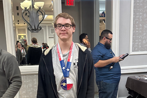 FHS chess students receiving his state medal