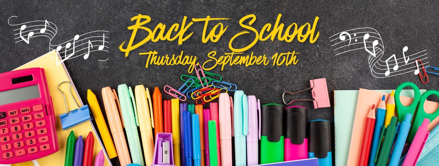 Colorful school supplies arranged with a 'Back to School' text above.