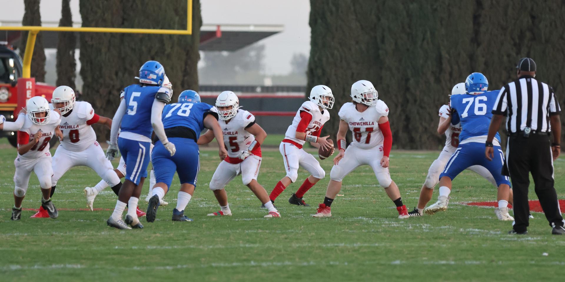 Junior Varsity football players in action against Caruthers