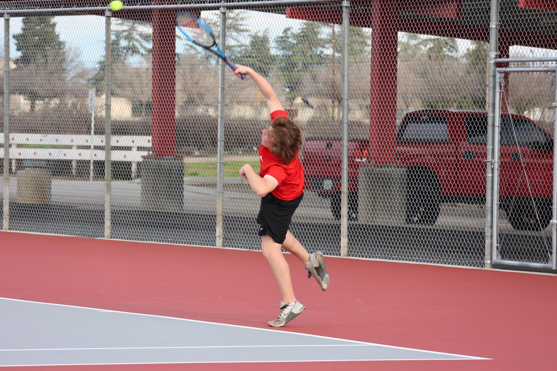 CUHS Boys playing tennis against coalinga