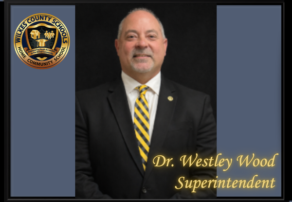 Headshot of Dr. Westley Wood with Wilkes County Schools logo in upper left corner.