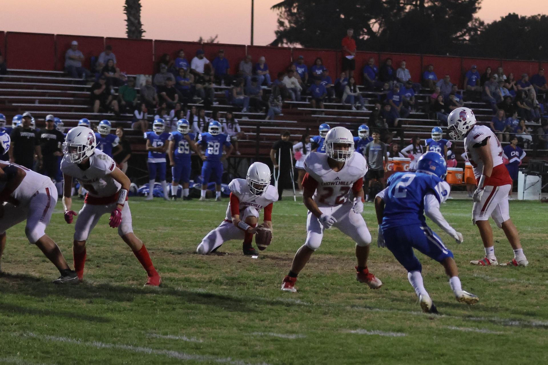 Junior Varsity football players in action against Caruthers