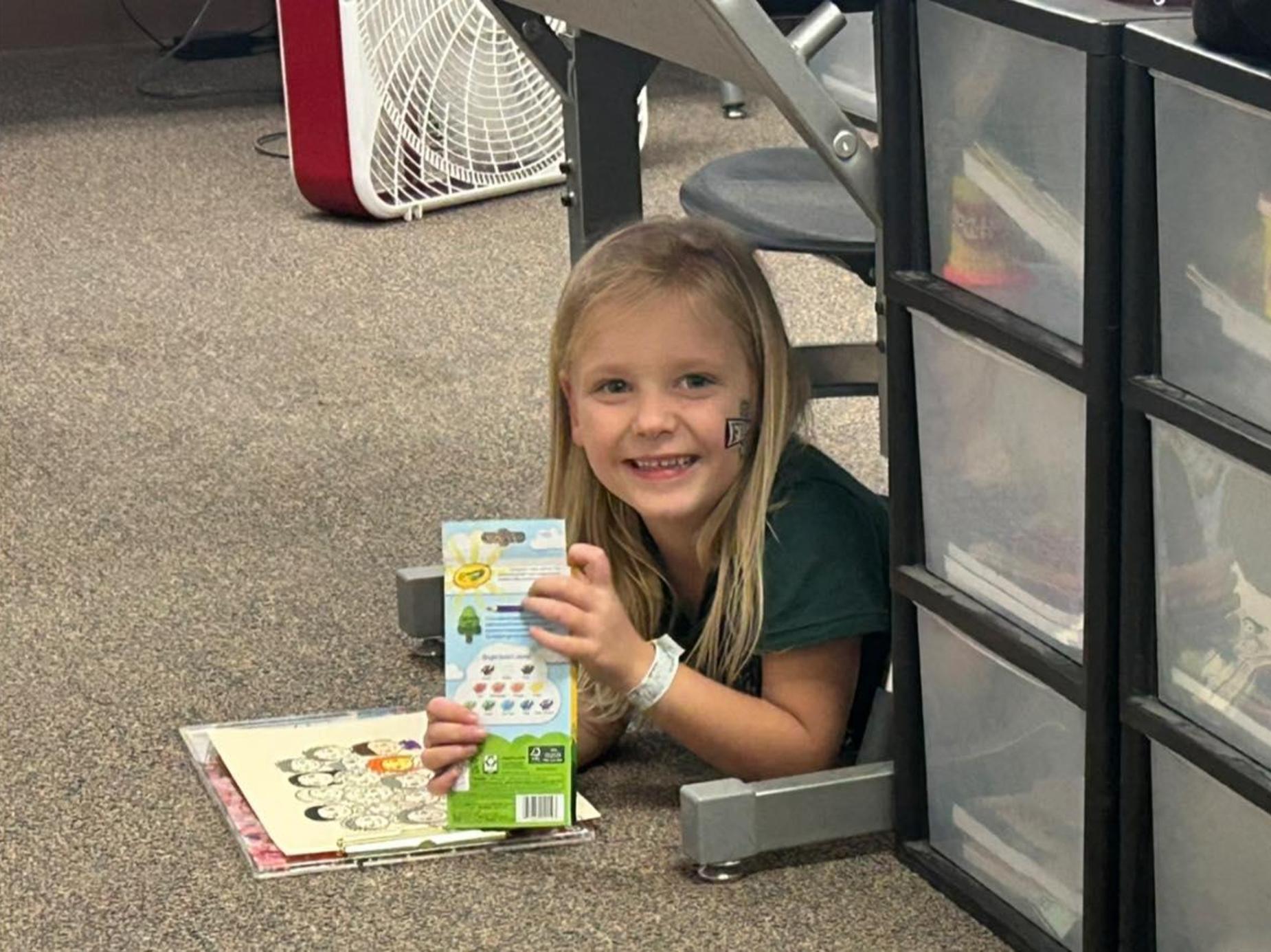 Student under desk