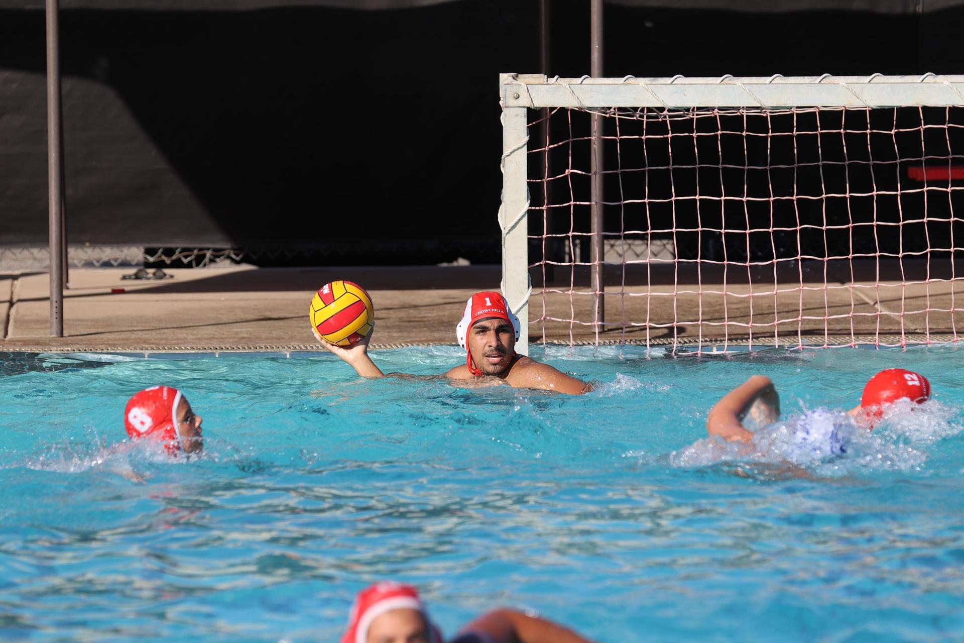 boys playing water polo against Madera