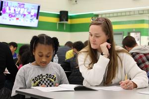 Buchanan Elementary students share writing with adults.