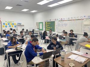 students sitting in class working on projects