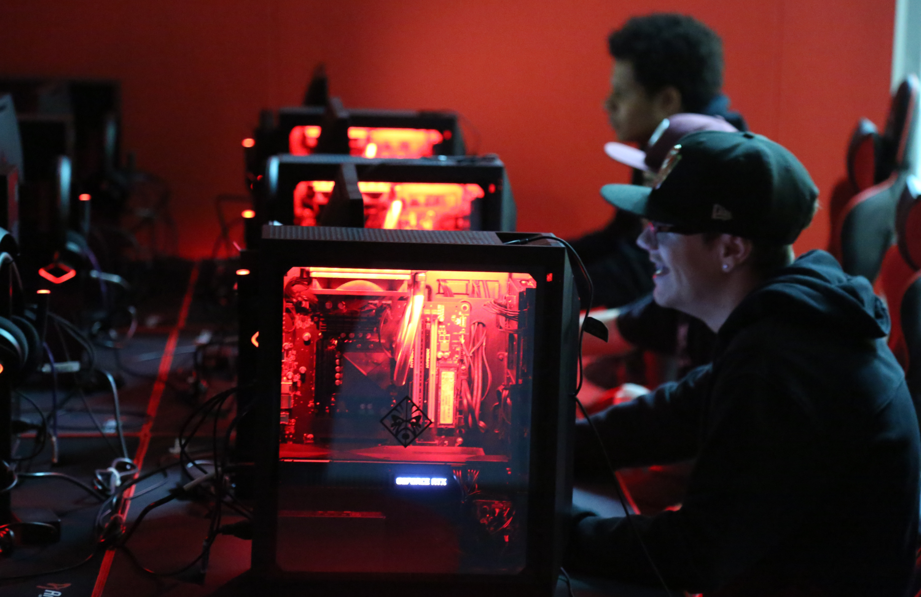 Shuffle banner for district homepage - infographic of students with the e-sports equipment