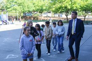 Fifth grade ambassadors walk with McGuire