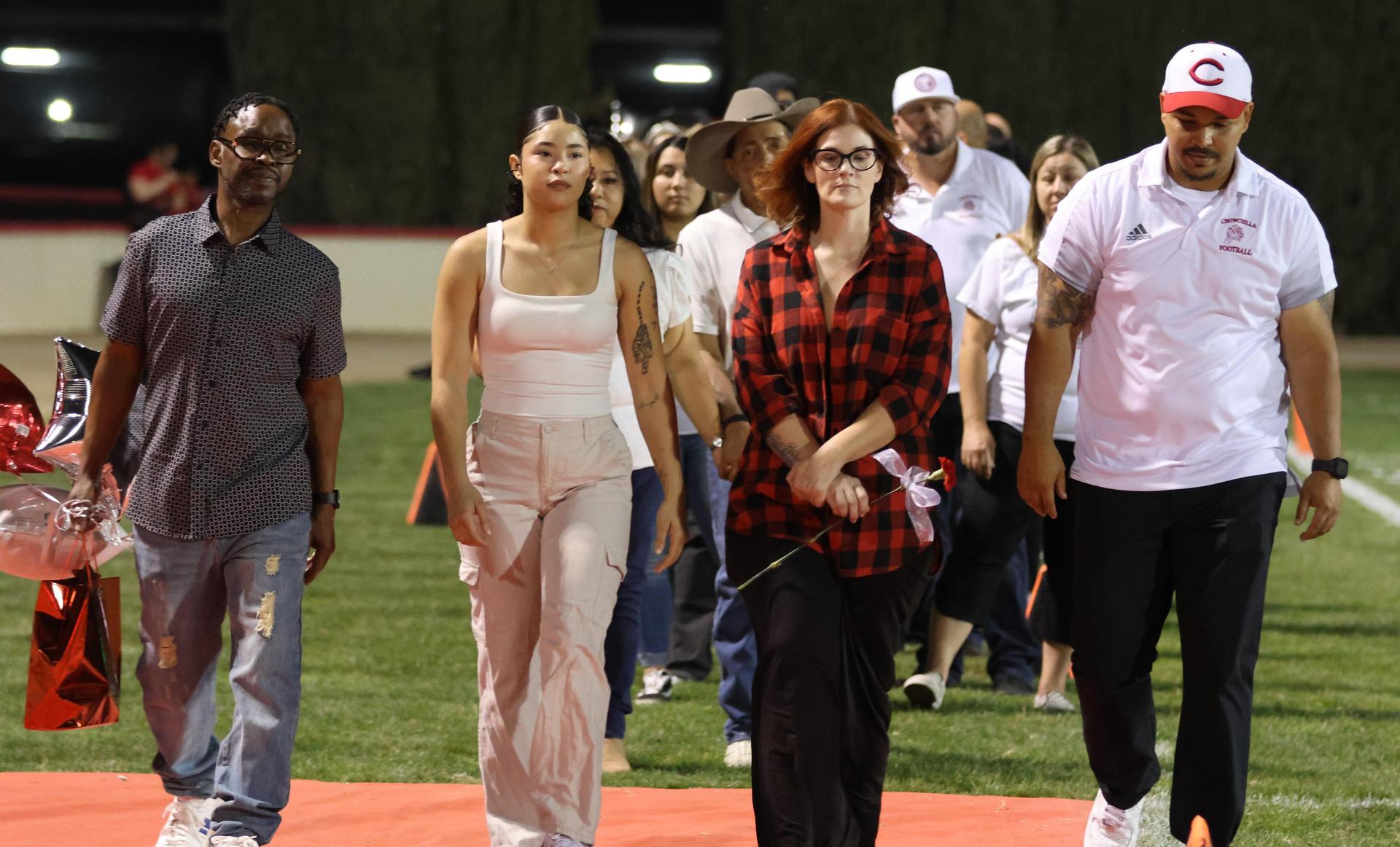 seniors and their escorts celebrating senior night