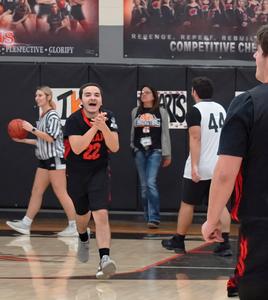 A player is all smiles after making a basket.