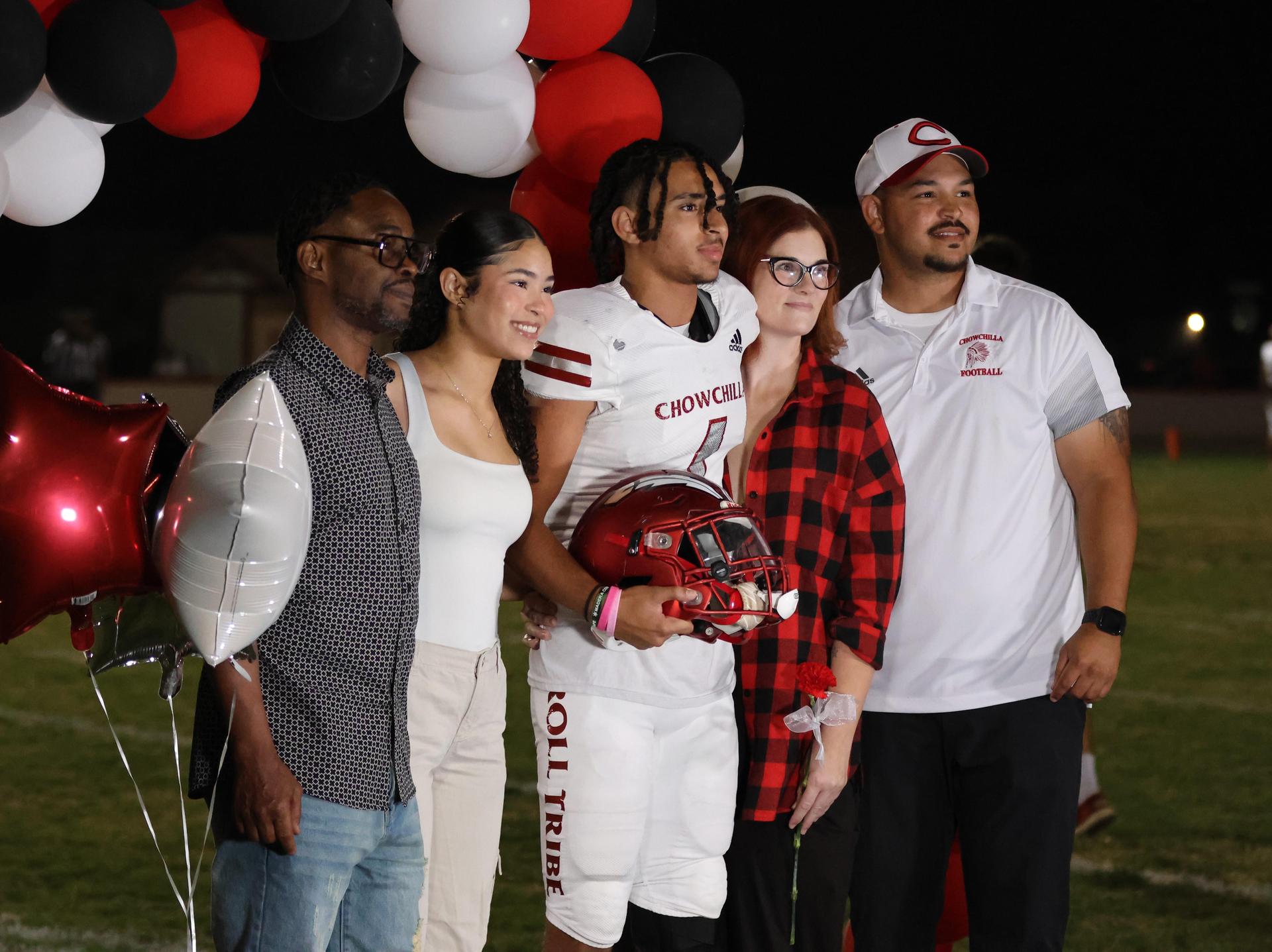 seniors and their escorts celebrating senior night