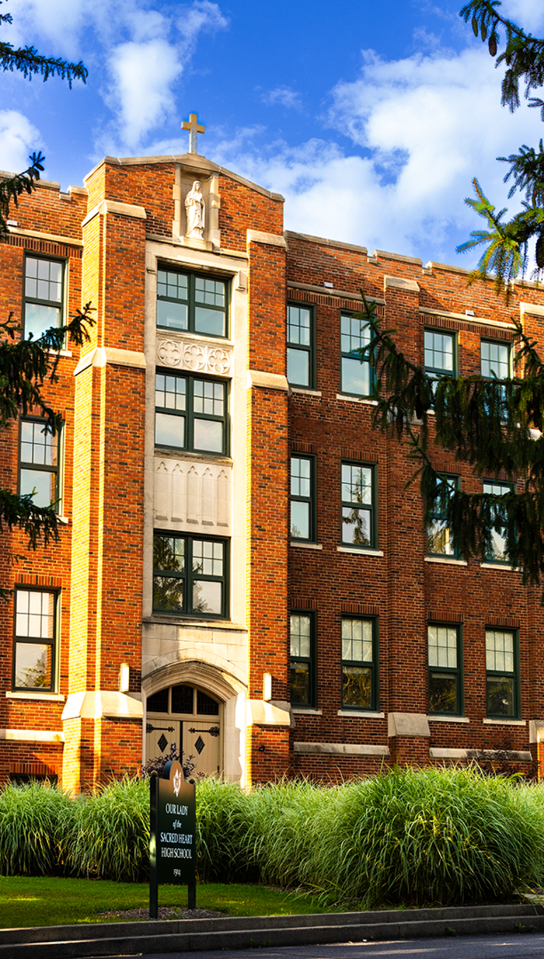 OLSH building behind trees