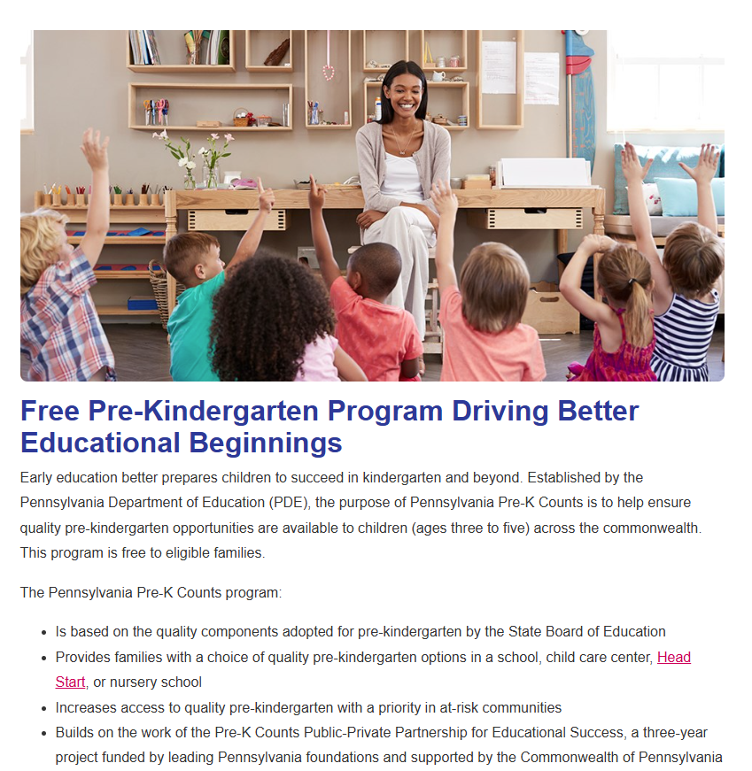A teacher reading to young preschool students who have their hands raised to answer a question.