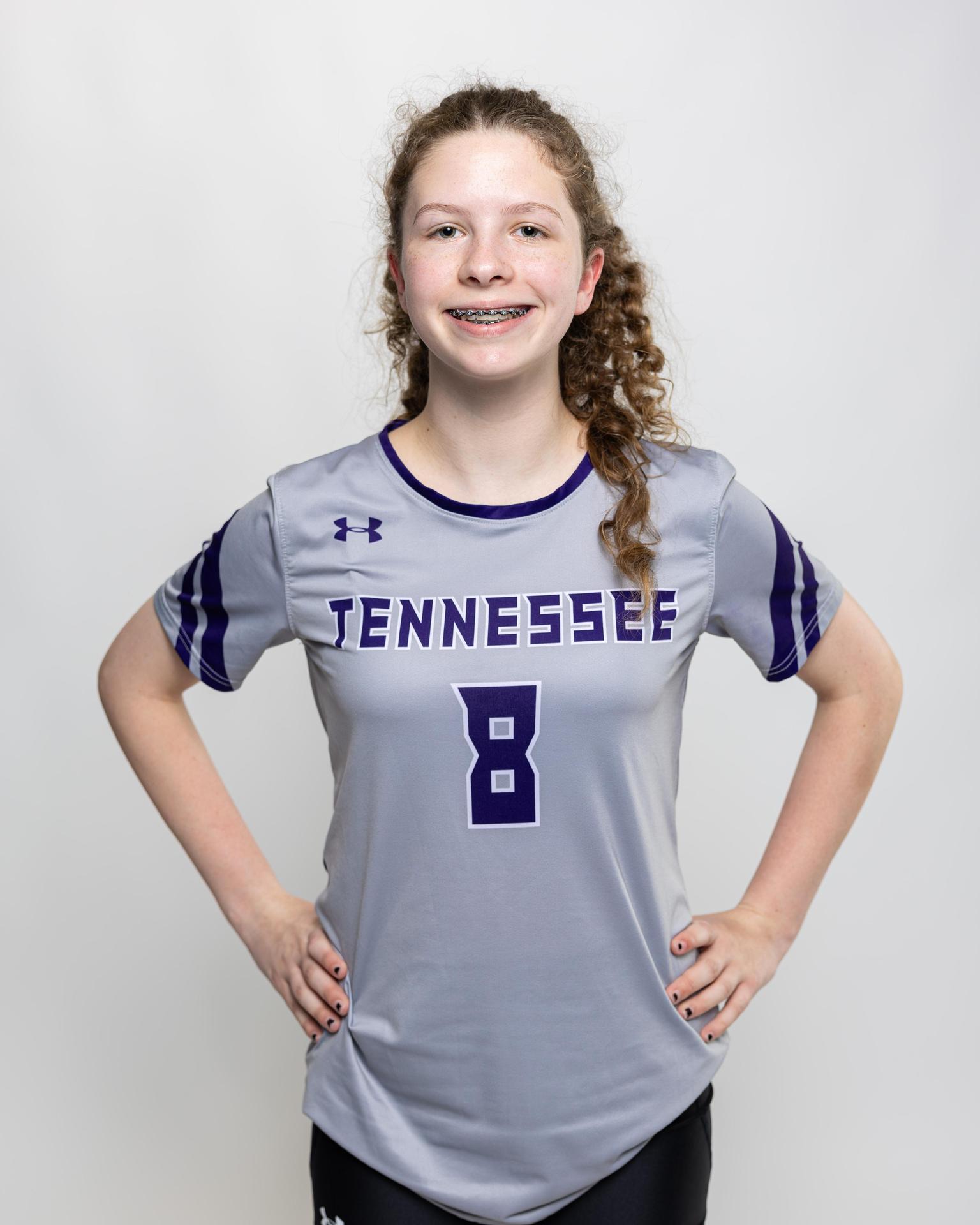 number 8 female volleyball player posing