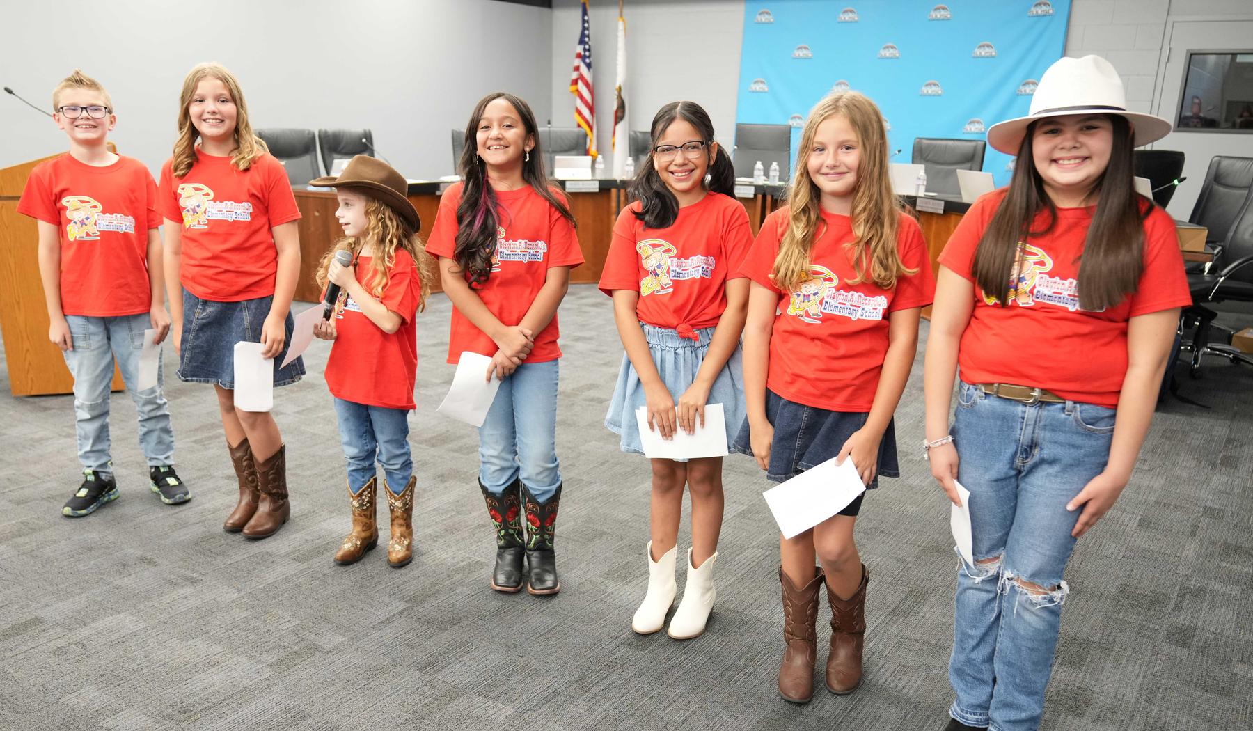 Students at Board meeting after board performance